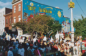 Festive crowd in front of Taller Puertorriqueno 